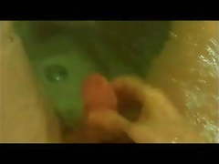 Masturbating and cumming underwater at the bathtub